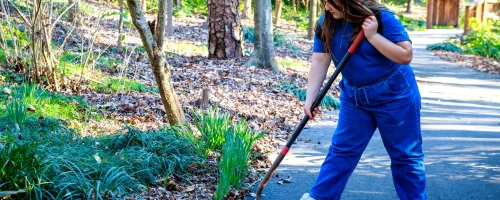 girl-volunteers-to-help-plant-grass-in-public-park-2025-01-08-03-46-28-utc